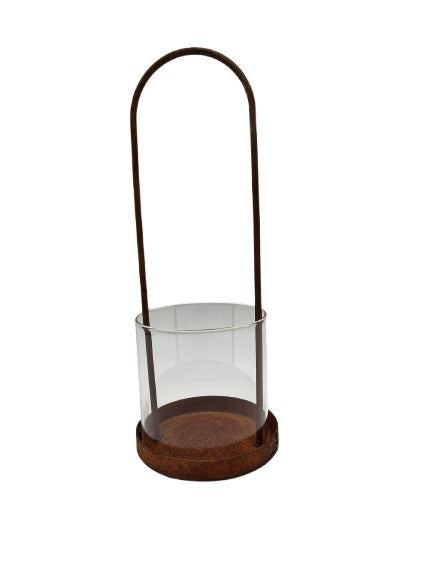 Lantern made of rusty metal with glass cylinder